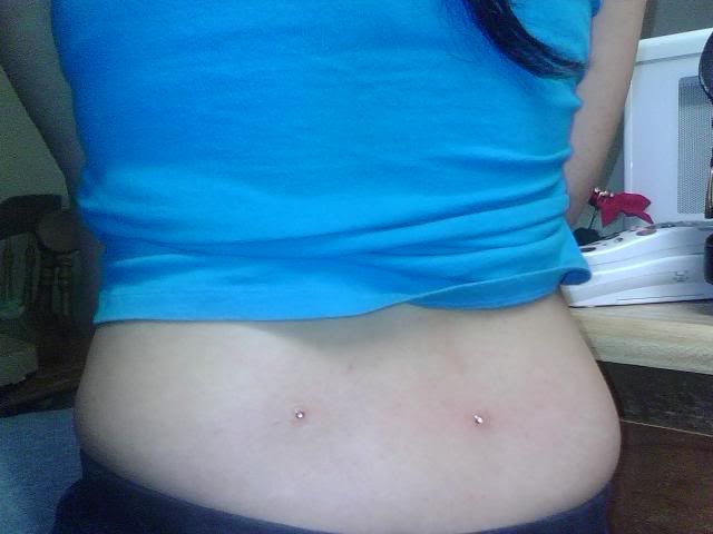 IMG00486.jpg MICRODERMAL LOWER BACK PIERCING